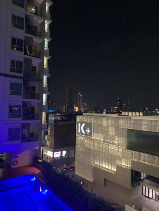 Night view of buildings with illuminated swimming pool