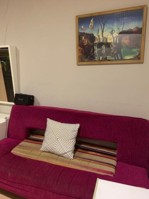 Living room with a sofa and wall art