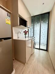 Modern kitchen with appliances and sliding glass door