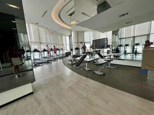 Modern gym facility with various workout equipment