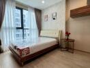 Modern bedroom with large window and natural light