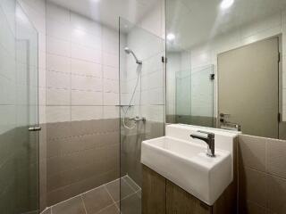 Modern bathroom with walk-in shower and sink