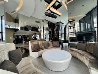 Modern living room with plush seating and contemporary lighting