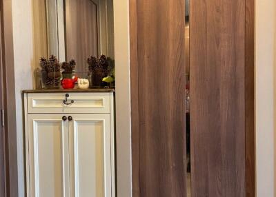 Bedroom closet with decorative items on a dresser