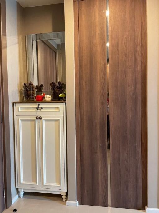 Bedroom closet with decorative items on a dresser