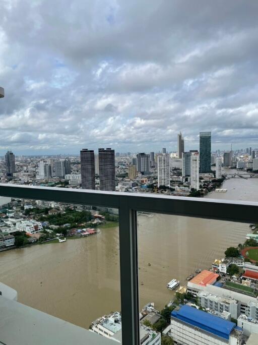 Cityscape view from high-rise balcony with river