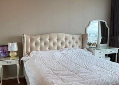 Modern bedroom with upholstered bed and vanity table