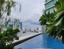 Infinity pool with city skyline view