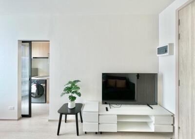 Modern living room with TV and minimalistic furniture
