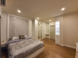 Spacious master bedroom with built-in wardrobes and a double bed