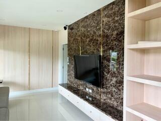 Modern living room with marble wall and TV