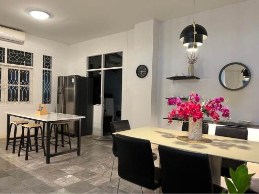 Modern kitchen with dining table and appliances