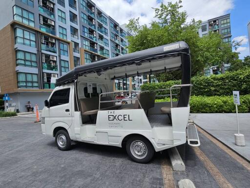 Shuttle service in front of modern residential buildings