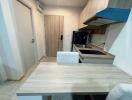 Compact kitchen with dining table