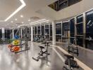 Modern gym with large windows and exercise equipment