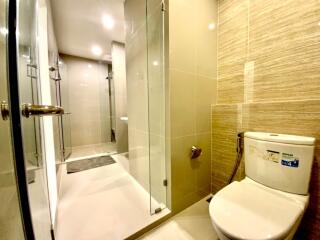 Modern bathroom with glass shower and toilet