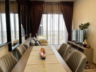 Modern living and dining area with natural light