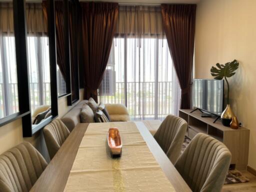 Modern living and dining area with natural light