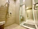 Modern bathroom with walk-in shower and glass partition