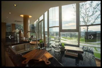 Modern kitchen with island and large windows