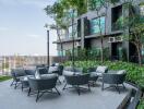 Modern outdoor seating area with gray chairs and a scenic view