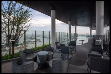 Rooftop lounge area with city and river view