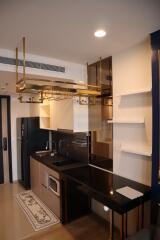 Modern kitchen with black countertops and gold accents