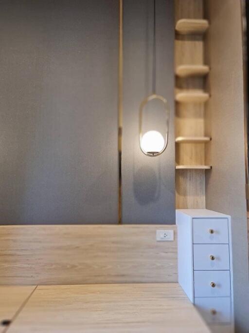 Modern bedroom corner with built-in drawers and shelves