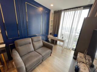 Modern living room with blue accent wall