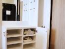 Modern closet with ample storage space and shoe rack