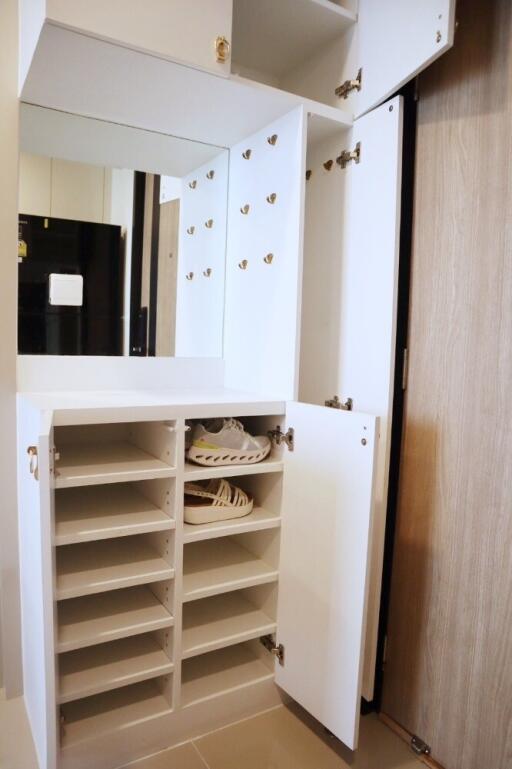 Modern closet with ample storage space and shoe rack