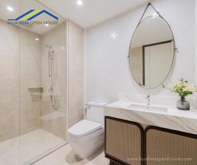 Modern bathroom with shower, toilet, and sink