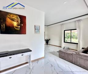 Modern living room with artwork and sofa