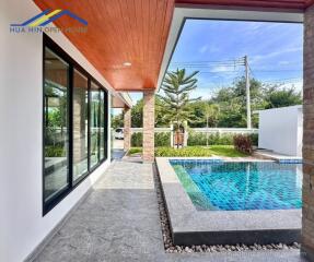 Outdoor area with a view of the pool and garden