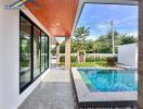 Outdoor area with a view of the pool and garden