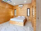 Bedroom with wooden walls and tiled floor