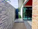 Patio area with outdoor shower and modern decor