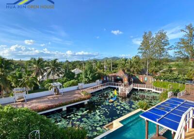 Outdoor recreational area with pool and lotus pond
