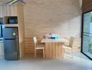 Modern kitchen dining area with wooden table and chairs