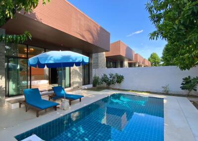 Outdoor area with swimming pool and seating