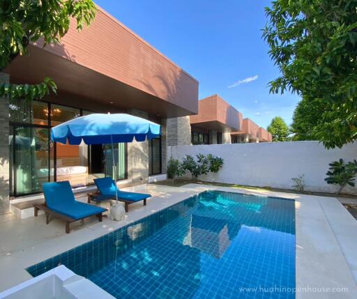 Outdoor area with swimming pool and seating