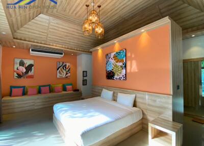 Modern bedroom with colorful decor and artwork