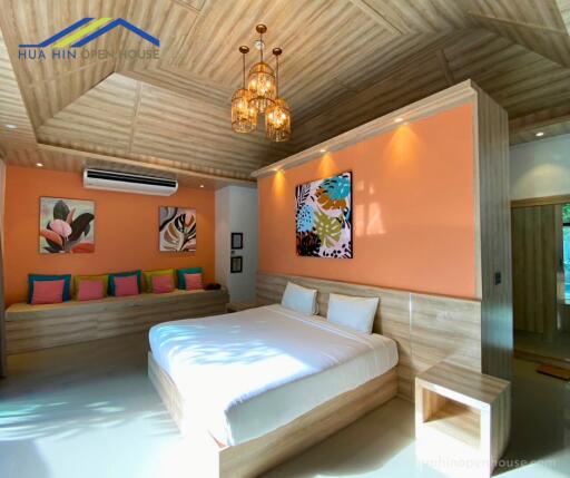 Modern bedroom with colorful decor and artwork