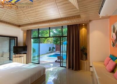 Spacious bedroom with pool view