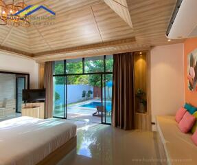 Spacious bedroom with pool view