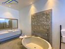 Modern bathroom with oval freestanding bathtub and decorative wall art