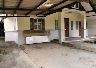 Outdoor view of the entrance with a small porch and steps