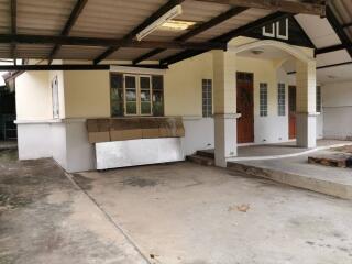 Outdoor view of the entrance with a small porch and steps