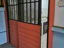 Red sliding door in a building with a view inside