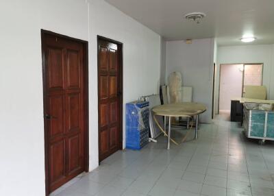 Hallway with wooden doors and furniture